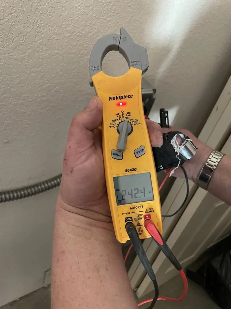 Voltage testing with clamp meter during Whole House Surge Protector in Strasburg